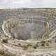 Illustration for article titled Heres How Much Earth Gets Blasted Away to Extract a Hunk of Diamond